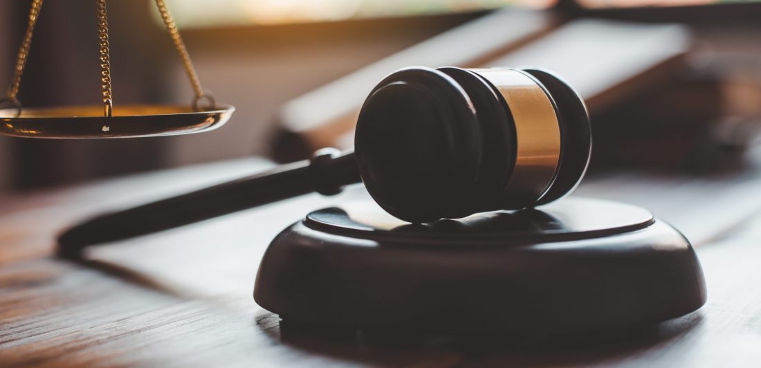 Law theme, mallet of the judge, law enforcement officers, evidence-based cases, and documents taken into account.