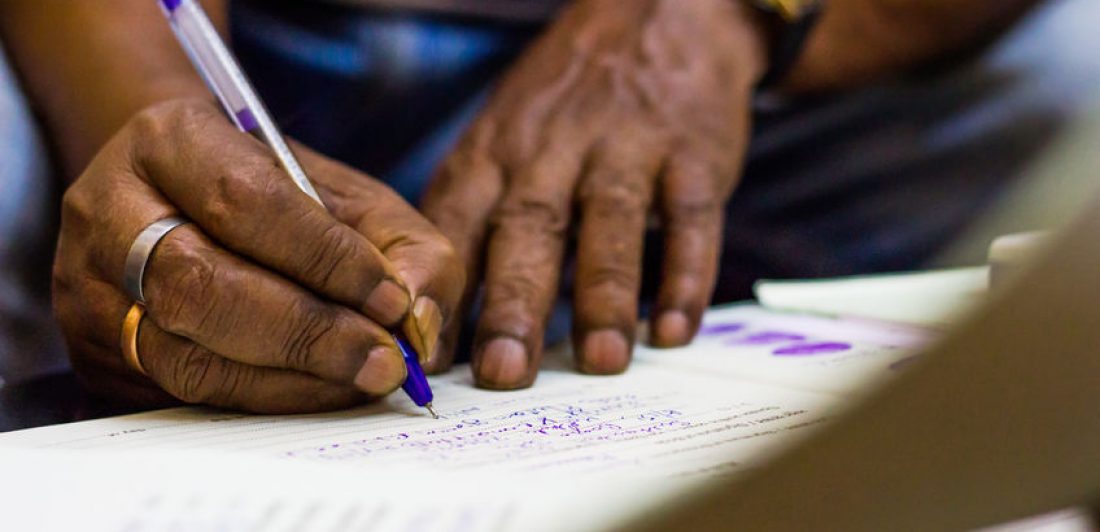 signing on an important paper. marriage registration witness hands