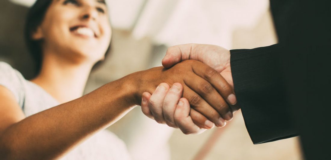 Closeup of Business Woman Shaking Partner Hand